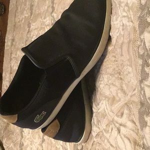 Lacoste mens slip on black loafers, size 11 US, 44.5 Euro, average condition.